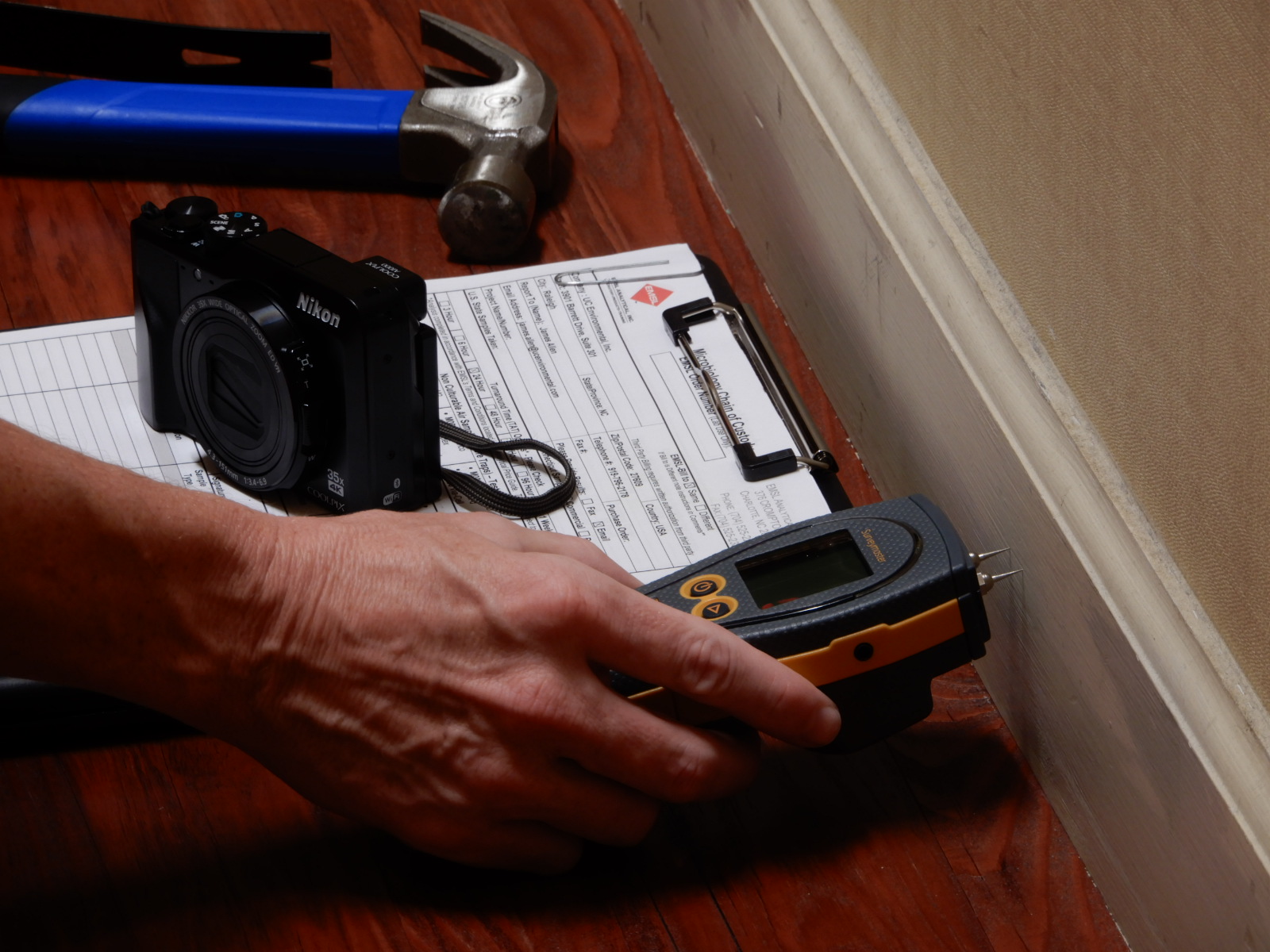 Moisture meter being used to evaluate building materials
